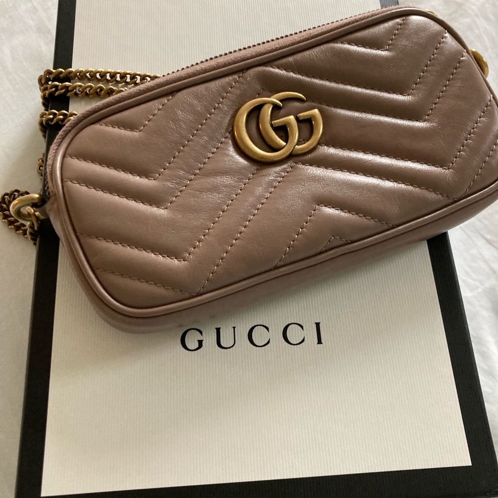 Brand New Gucci GG Marmont quilted leather mini-bag.